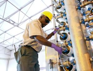 A technician makes seawater desalination