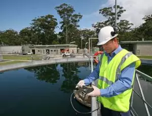 Technician in front of a wastewater basin at the Gerringong sewage treatment plant in Australia (reuse of treated wastewater)