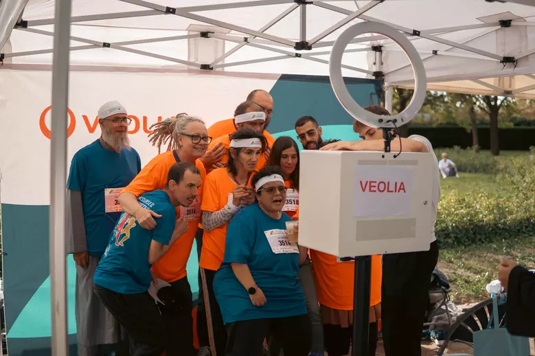 Participants celebrating the end of the Diversity Run, Veolia